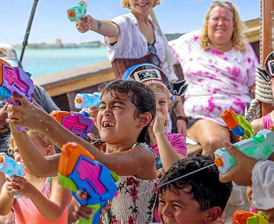SST Kids playing with water gun on pirate ship